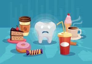 Tooth surrounded with sugar unhealthy food